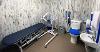 Accessible changing room with toilet, sink, bed and hoist